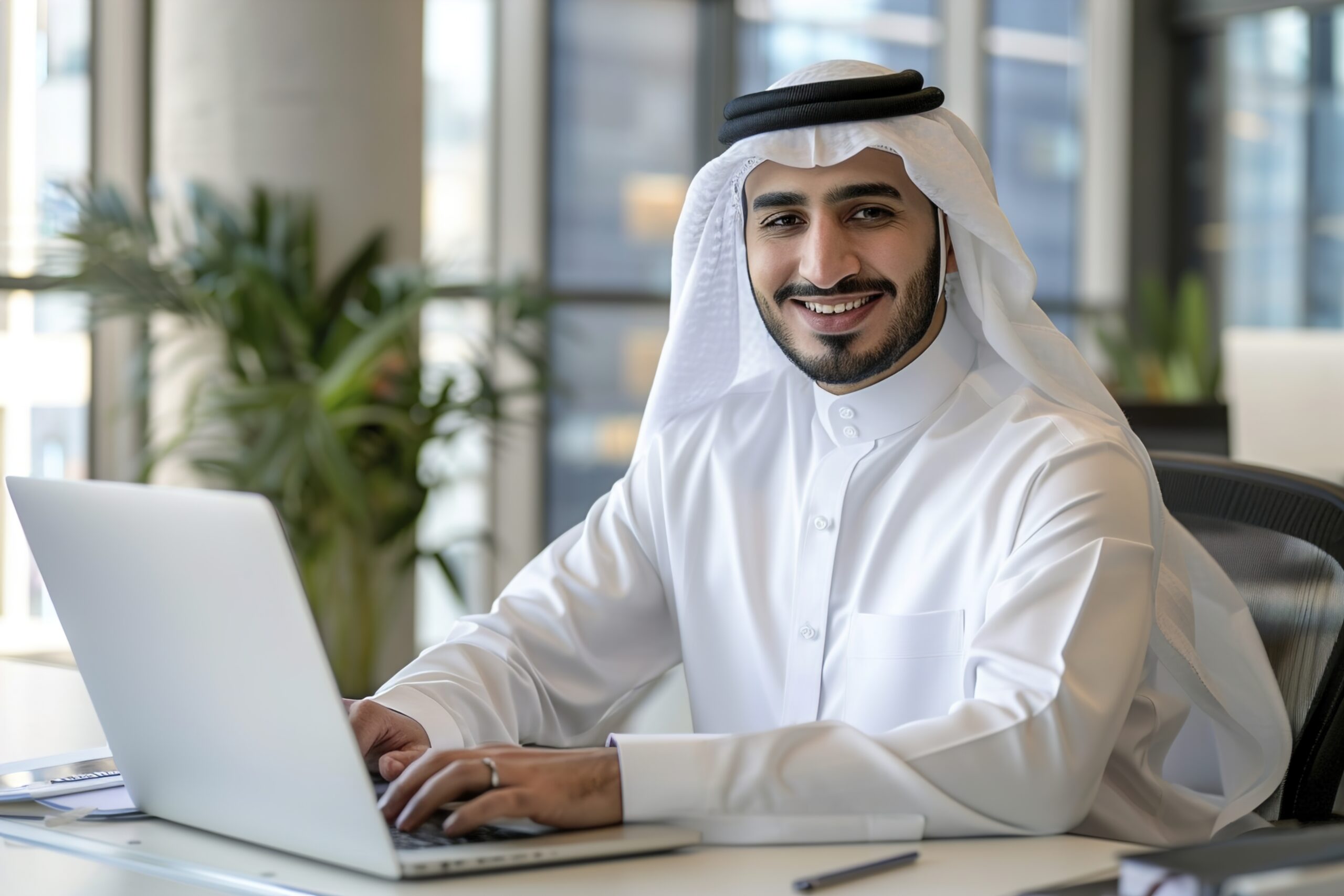 A Portrait Of Smiling Middle Eastern Male Manager Working Portrait Of Smiling Middle Eastern Male Manager Working